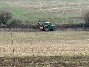 Sub Contractor trimming the hedges away from Deer fencing