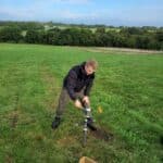 Hammering a soil core at the North Wyke Demonstrator Hub site.