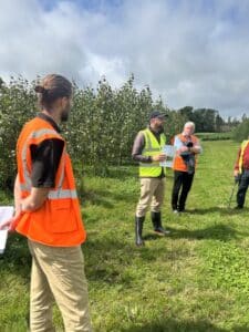 Callum Williams, William Macalpine and Chris Johnston in front of the SRC poplar introducing the Royal Forestry Society (Northern Ireland) visitors to the Biomass Connect site at AFBI.