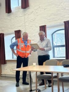 Chris Johnston is presented with a framed certificate to commemorate the visit from the Royal Forestry Society’s Northern Ireland Division by RFS Vice-president James Hamilton-Stubber